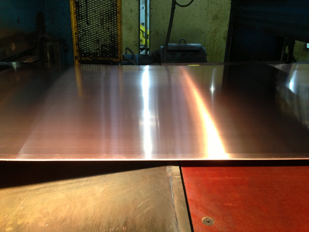 Picture of copper strip in a copper mill processing line