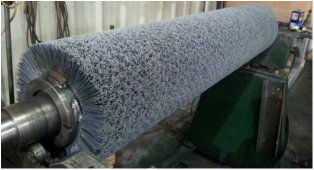 Picture of a wide face abrasive bristle brush in our dynamic balancing machine