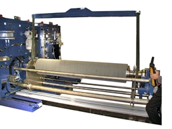 Picture of a flat metal strip brush machine for cleaning and finishing wide strip metal with abrasive and/or non-abrasive brushes, show ease of brush quick change 