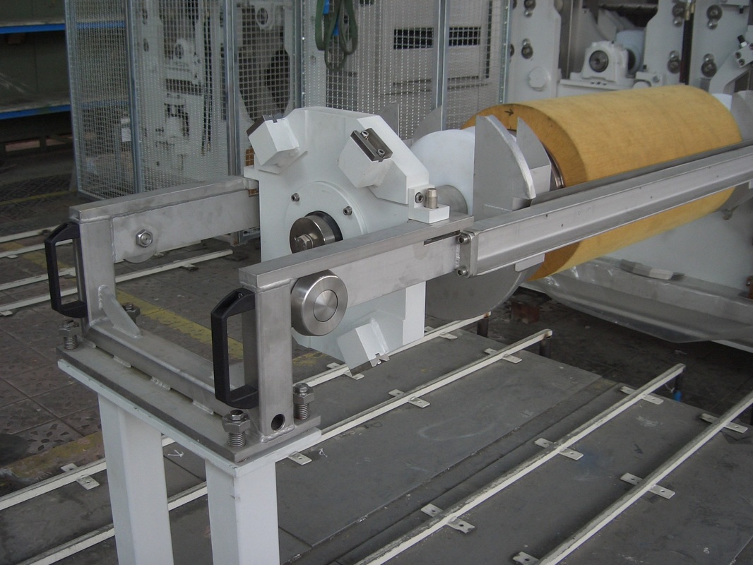 Picture of impregnated abrasive non-woven wide face scrubber brush in brush machine for metal strip cleaning line