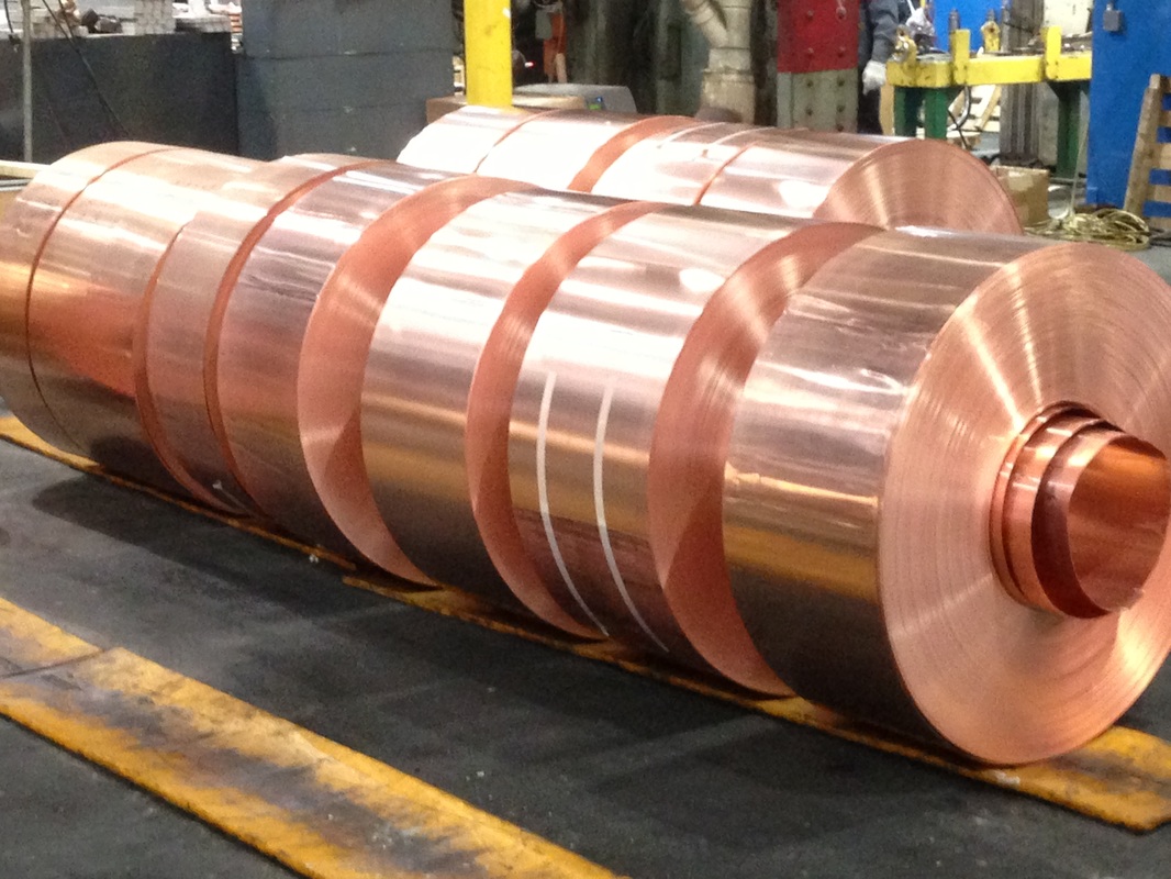 Picture of cleaned and brushed copper strip coils in a copper mill
