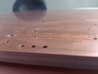 Picture of copper sheet for printed circuit board being deburred