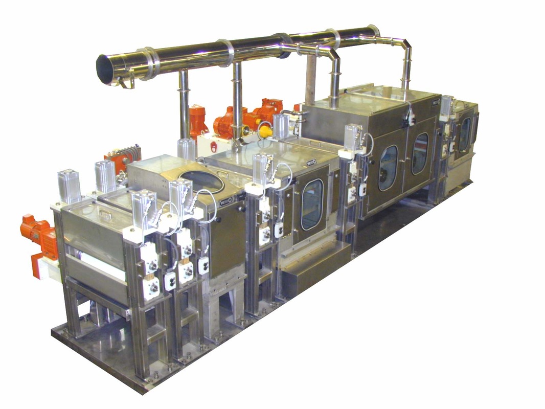 Picture of complex flat metal strip brush machine line for cleaning and finishing narrow strip metal with abrasive and/or non-abrasive brushes to clean copper, steel, stainless steel, aluminum, titanium, and other special alloys